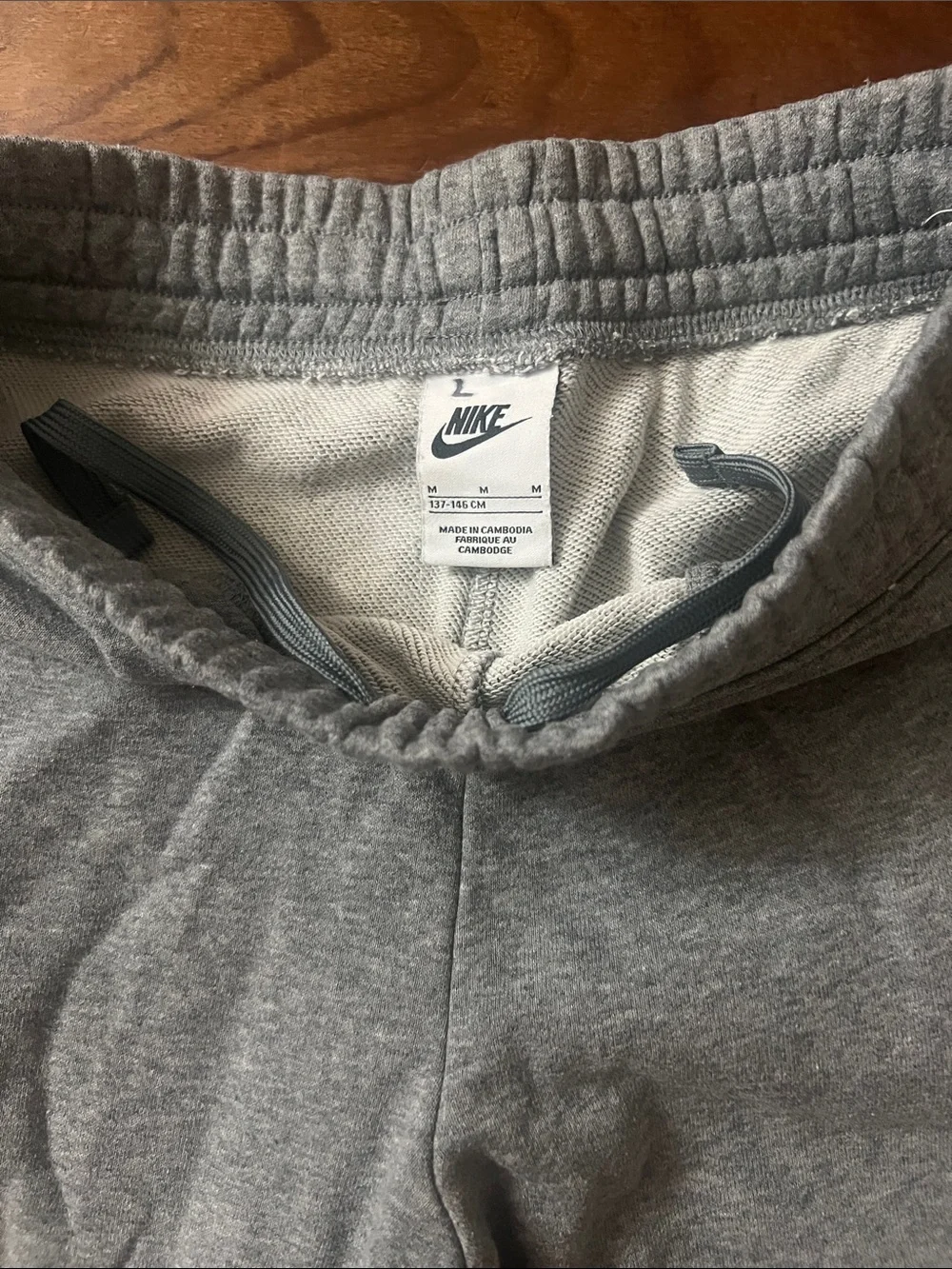 Nike Gray girl’s Sweatpants with Pink Swoosh